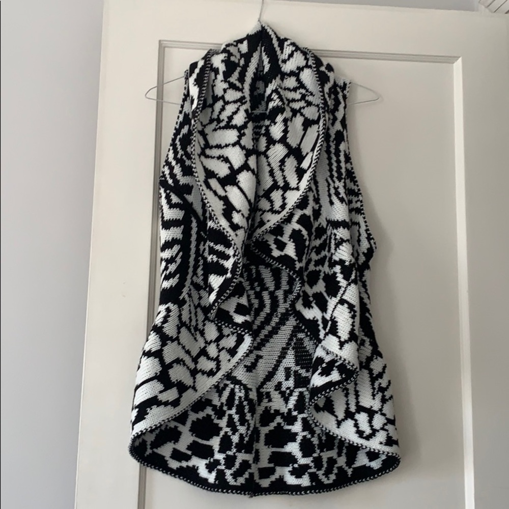 Black and white peplum vest